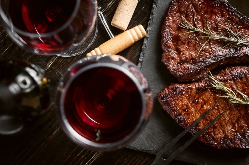 How to Grill a Perfect Steak and enoy a glass of red wine
