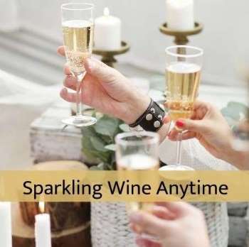 Sparkling Wine glasses raised in a toastfrom a bottle of bubbly