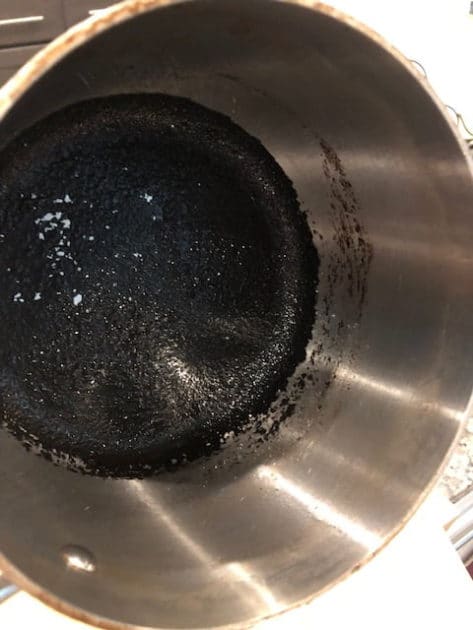 Food burnt in bottom and side of pot