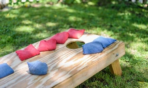 Cornhole is a fun game for your Backyard BBQ dinner party guests