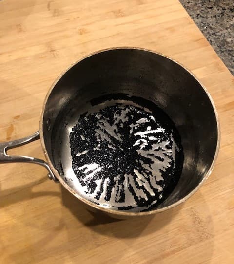 Clean a burnt pot with baking soda and elbow grease