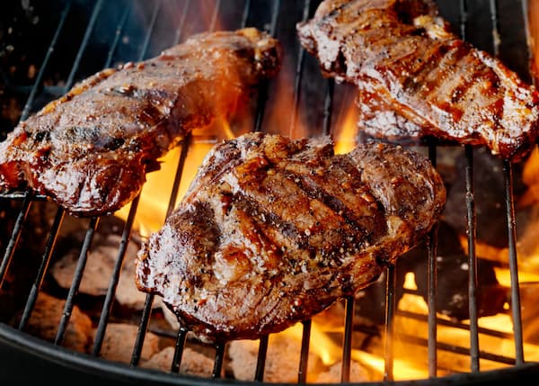 Steaks with good sear marks on the charcoal grill