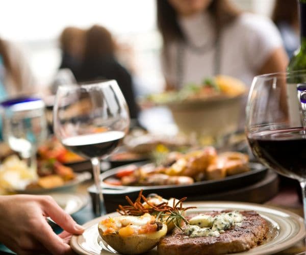 Glasses of wine with food and friends