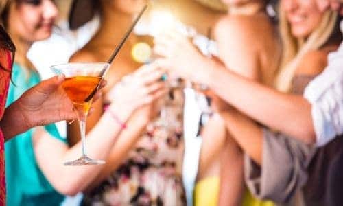 Friends toasting at a cocktail party