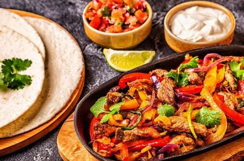 Sizzling platter of beef fajitas to cook for Father's Day