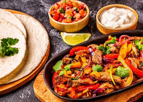 Sizzling platter of beef fajitas to cook for Father's Day