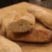 Three homemade baguettes baked without bread flour cut in half