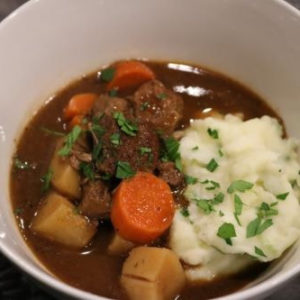 Slow Cooker Beef and Guinness Stew over mashed potatoes