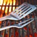 Best Grill Tools featured image with spatula and fork on grill grates