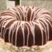 Dark Chocolate Bundt Cake with Red wine glaze on a glass cake stand