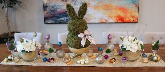 Gold and jewel-toned eggs with moss Easter Bunny Tablescape