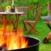 Grill lit up with wine on tables for backyard bbq