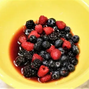 Let berries stand in sauce for at least one hour