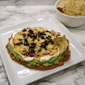 Mexican layered tostito dip recipe with chips