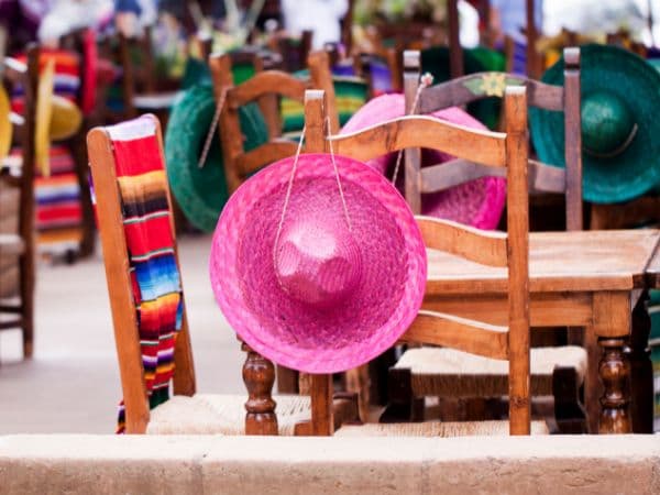 tables and chairs in a Mexican themed restaurant