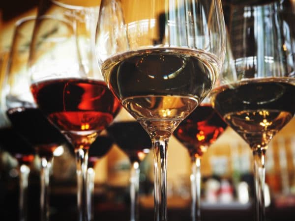red and white wines in glasses to pair with spicy foods