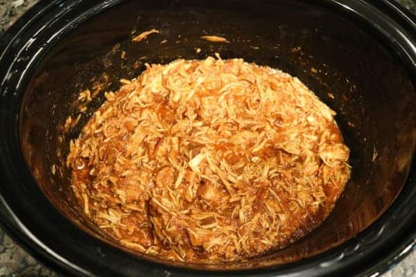 pulled chicken warming in slow cooker